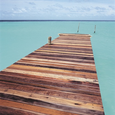 Wooden jetty leading out to sea