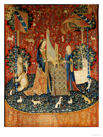 The lady, wearing an orange surcoat over a fitted dark blue dress, plays a portative organ on top of a table covered with a Oriental rug. Her maidservant, dressed in a sleeved surcoat of dark blue and rust, with gold inner sleeves, stands to the opposite side and operates the bellows. The lion and unicorn once again frame the scene holding up the pennants of the le Viste family. A unicorn is to the lady's left and a lion to her right. The tapestry is decorated with an overall mille fleurs design, and in the foregroud are rabbits and dogs.
