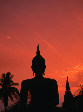 Buddha Against a Sunset at Wat Mahathat, Sukhothai, Thailand