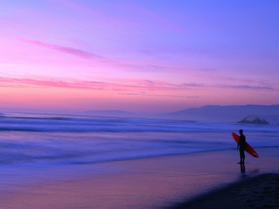 Surfer on Ocean Beach, San Francisco, California, USA