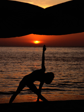 Woman Doing Yoga at Sunset, Phuket, Thailand, United States of America