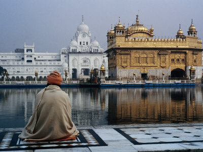 Sikh Man Meditating in Front of the Golden Temple, Amritsar, India