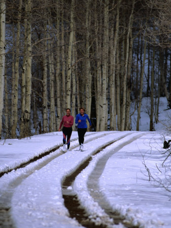 Women Jogging in a Wintery Park City, Park City, Utah, USA