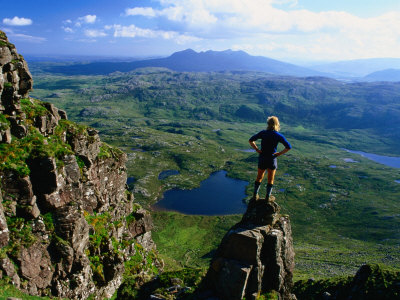 Walker Looking Towards Suilven from Stac Pollaigh, Scotland