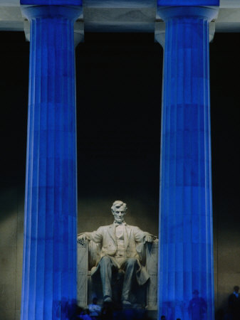Abraham Lincoln Statue Between Blue Floodlit Columns of Lincoln Memorial, Washington Dc, USA