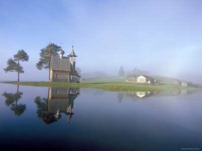 Porzhensky Pogost Graveyard & C17th St. George Church in Glazovo Village in Mist, Russia