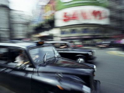 Taxis in Piccadilly Circus, London, England, United Kingdom