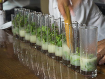 Row of Glasses on a Bar with Barman Preparing Mojito Cocktails, Habana Vieja, Havana, Cuba Posters