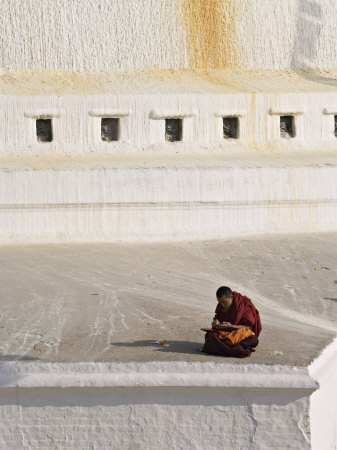 Tibetan Buddhist Monk Reading Scriptures at the Boudha Stupa at Bodhanath, Kathmandu, Nepal