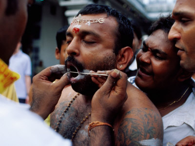 Devotee Having Cheeks Pierced During Thaipusama Festival, Singapore
