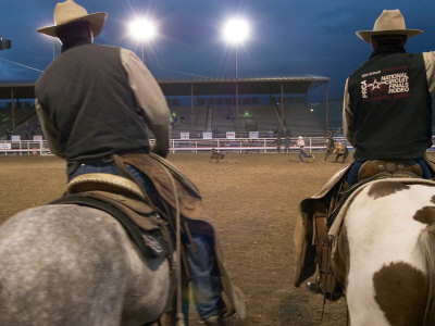 Cowboys on Horseback at Cody Night Rodeo, Cody, Wyoming