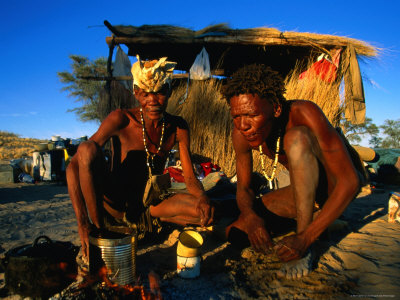 Kalahri Bushmen Cooking on Fire Outside Their Grass Homestead, South Africa