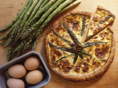 Overhead Shot of Asparagus Quiche, a French Vegetarian Dish, with Eggs and Raw Fresh Asparagus