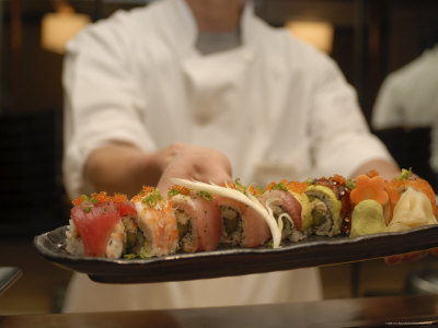 Sushi Chef Presents a Plate of Various Seafood Sushi, Japan, Asia
