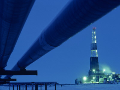 Alaska Oil Pipeline and Oil Rig at Night