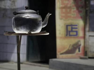 Buy Teapot Warms on a Solar Stove in a Street, Qinghai, China at AllPosters.com