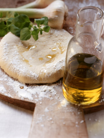 Unbaked Pizza, Herbs, Garlic and Olive Oil