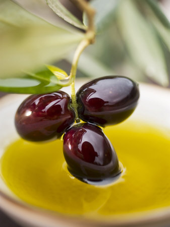 Dipping Olive Sprig with Black Olives in Olive Oil