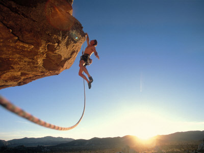 Rock Climber Dangling Off of Cliff Poster