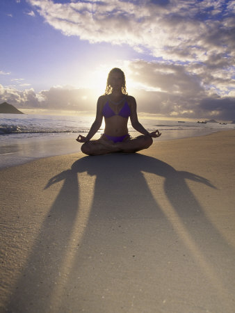 Woman Meditating on Beach
