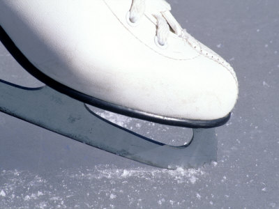 Close-up of Figure Skate on Ice