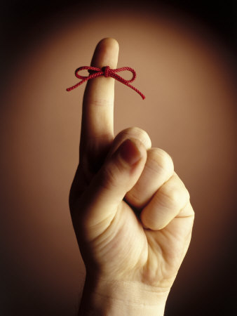 Red String Tied Around Index Finger