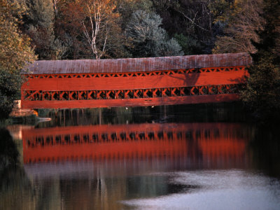 Buy Morning Light Reflects Red Covered Bridge in River at AllPosters.com