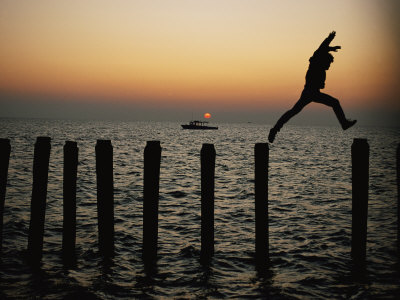 Buy Bo Hoppin Leaps Between Pilings in the Chesapeake Bay off Great Fox Island, Virginia at AllPosters.com