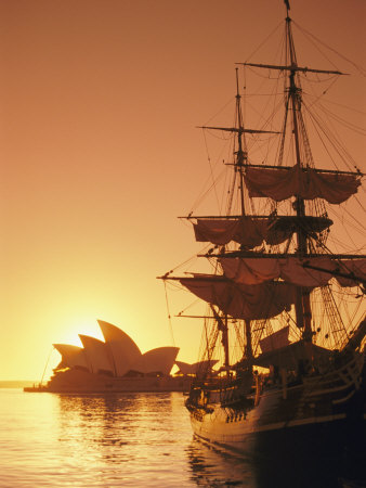 Sydney Opera House and the Hms Bounty, a Replica of the Famous Ship, Silhouetted by the Setting Sun