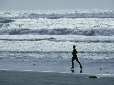 Buy A Person Jogs Along the Beach at AllPosters.com