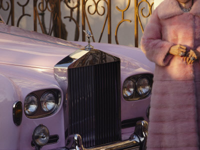 Buy A Woman Wearing a Pink Mink Coat Stands Next to a Pink Rolls Royce at AllPosters.com
