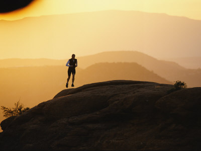 Buy A Woman Runs on Red Rocks at AllPosters.com