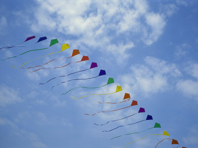 Buy Kites Fly in a Rainbow of Colors at the Jockeys Ridge Kite Festival at AllPosters.com