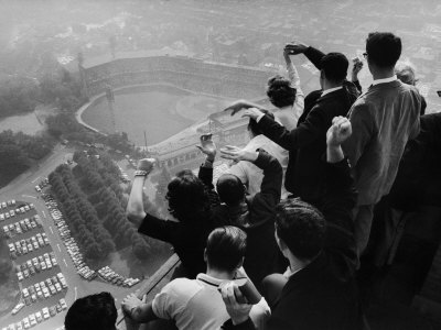 University of Pittsburgh Students Cheering Wildly from Atop Cathedral of Learning, School