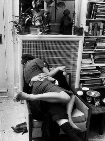 Amorous Couple Wrapped Up with Each Other During a Cocktail Party at a Private Home