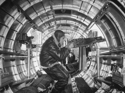 Crewman Poking His 50 Cal. Machine Gun Out of Side Window of B-17E Flying Fortress During WWII