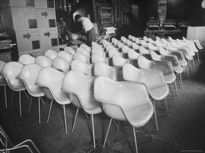 Chairs Designed by Charles Eames Made of Molded Plastic and Plywood