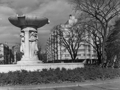 Buy Fountain in Dupont Circle, with Dupont Plaza Hotel Visible in Background at AllPosters.com