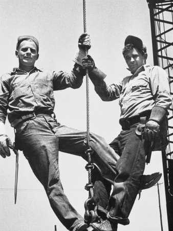 Construction Workers Standing on a Wreaking Ball