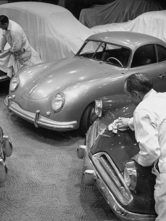 Man Polishing the 1953 Starliner Studebaker, Which is Capable of Taking Sharp Curves at High Speed