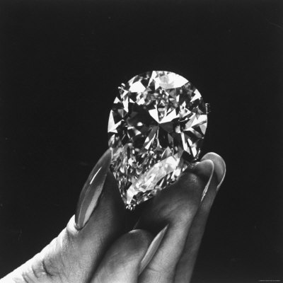 Actress Elizabeth Taylor Displaying Her Diamonds, Bought from Cartiers