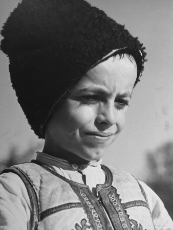 Young Rumanian Boy Wearing a Sad Expression Upon His Face