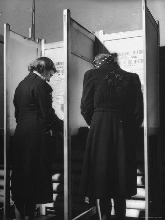 Voters Marking Their Ballot Papers in Voting Booths