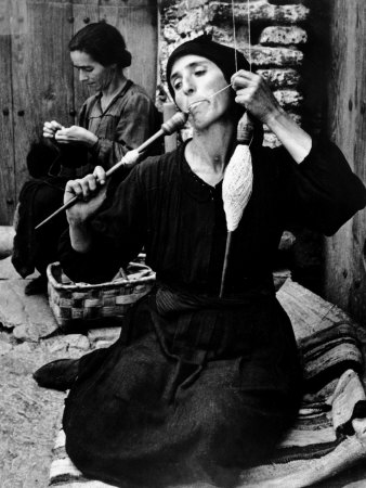 Spanish Peasant Using Ancient Methods to Spin Flax Into Thread