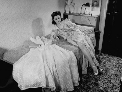 Pretty Girl at the Scott Hotel Putting on Nail Polish For the Dance