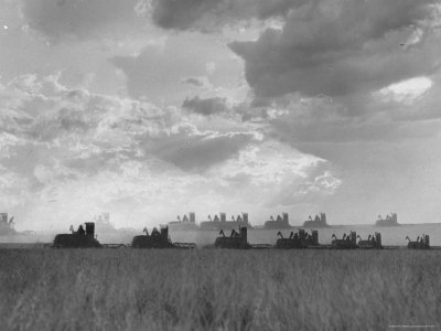 Buy Wheat Harvest Time with Two Lines of Combines Lining Up in Field with Threatening Sky at AllPosters.com
