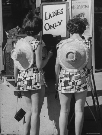 Women Outside Movie Theater Reading Signs