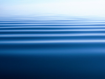Small Gentle Ripples Move Across the Calm Surface of the Arctic Ocean