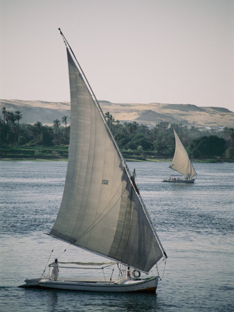 Twin Feluccas Move in Unison on the Nile Near Luxor