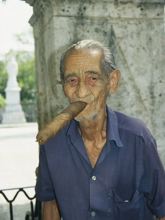 An Old Man Smokes an Over-Sized Cigar